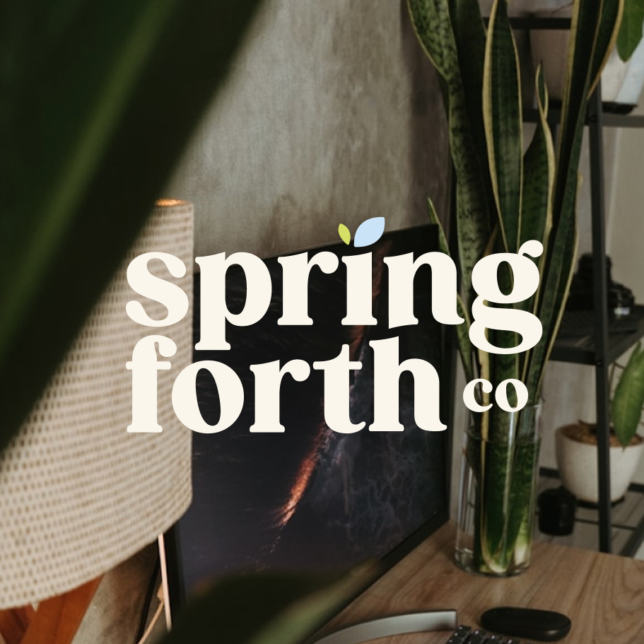 Decorative logo overlay with white text reading 'springforth co' and a small green and blue leaf, placed over a home office or living room scene with a plant and a monitor.
