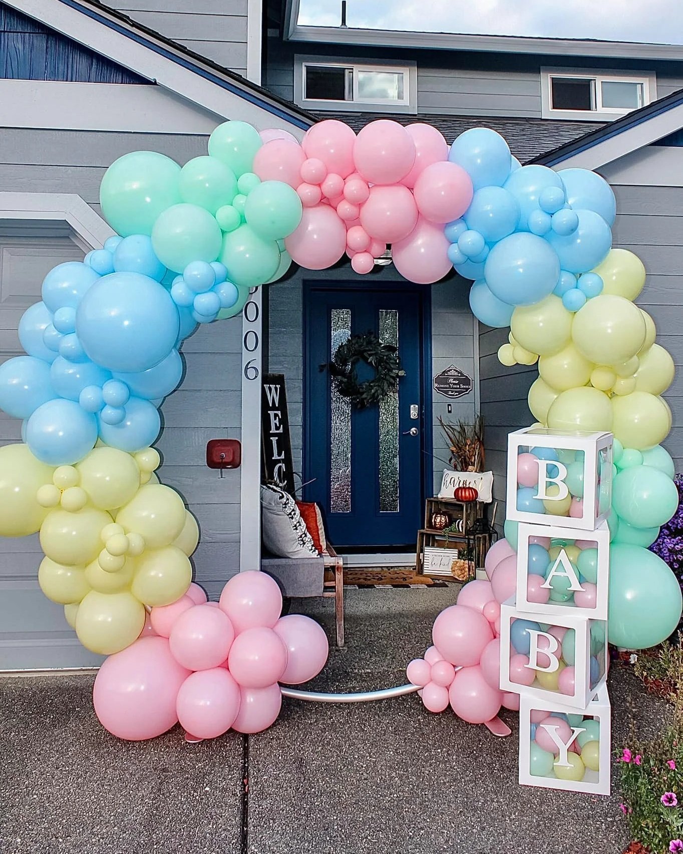 Soft pastel colored balloons around a large hoop for baby shower decorations backdrop in Puyallup, WA