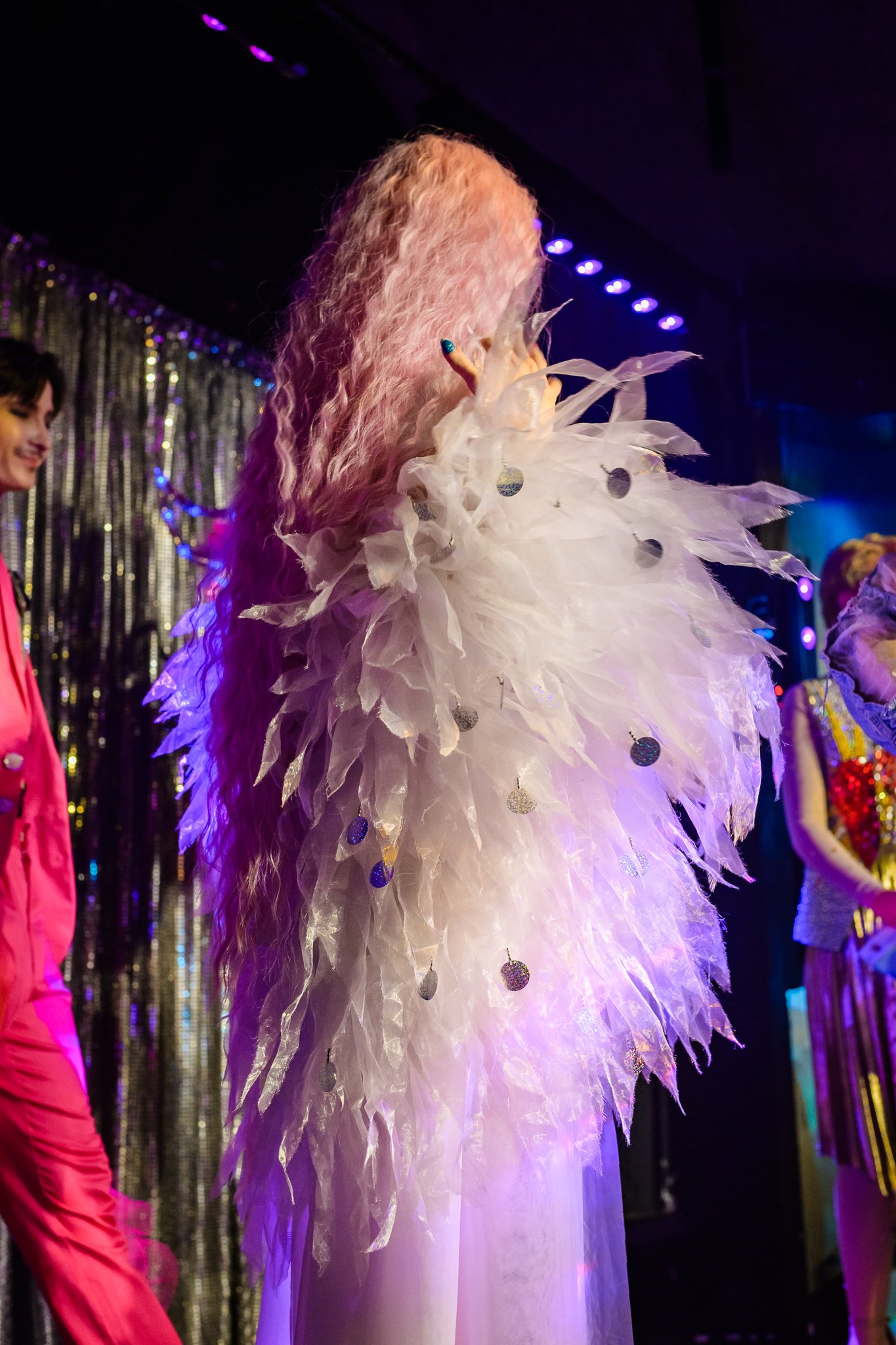   Drag performer Cherrylynn Fizzle Pop on stage with the cast at the end of the show  
