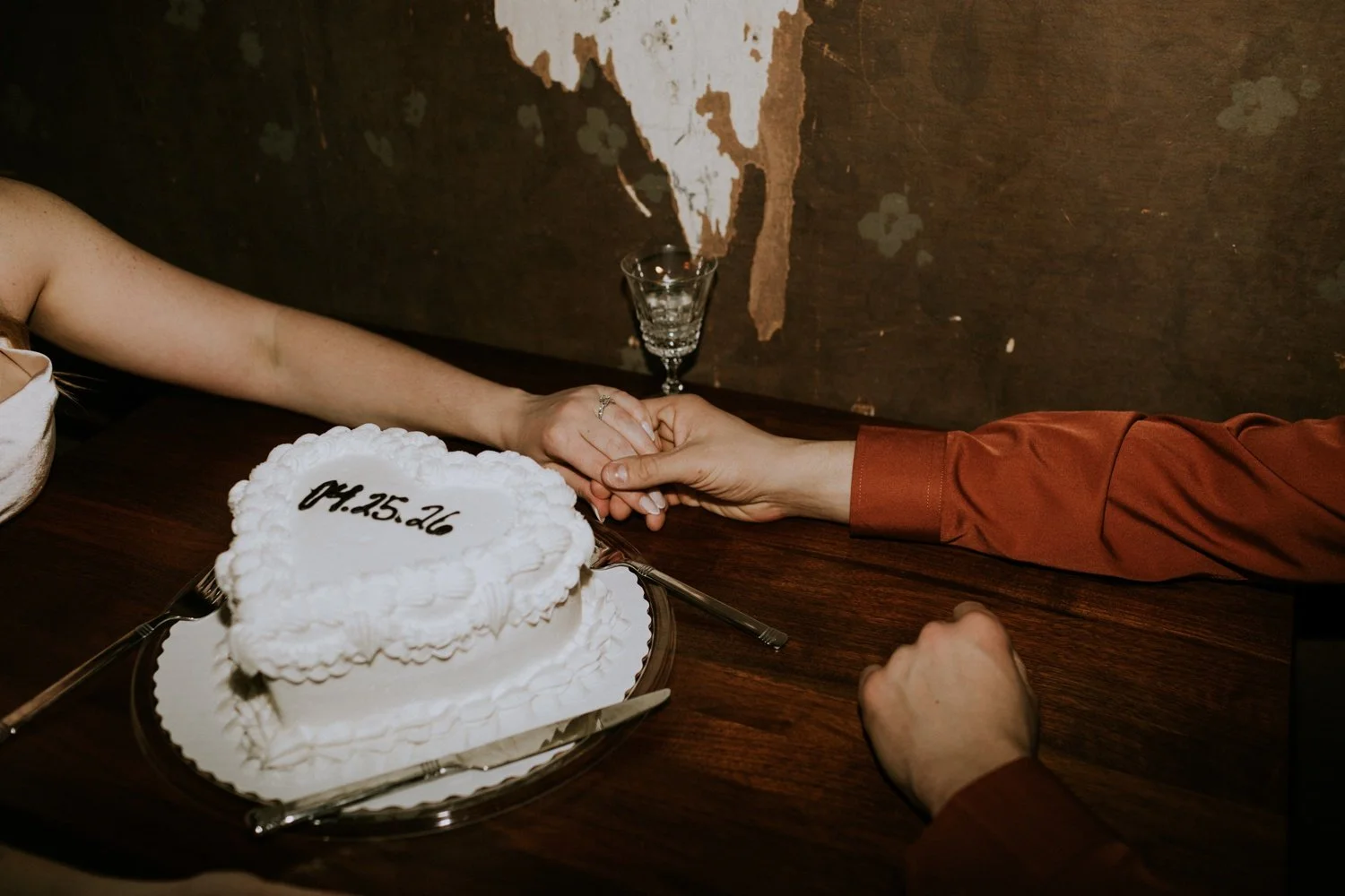 heart shaped white cake with wedding date in black icing at the daisy lounge in downtown stevens point wisconsin