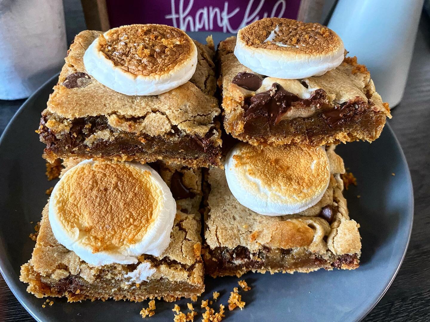 Next week we will be offering our S&rsquo;mores Bars in our takeout window. These delicious cookie bars have a buttery graham cracker crust, a gooey cookie center with chocolate chips and a perfectly roasted marshmallow on top. The perfect fall &ldqu