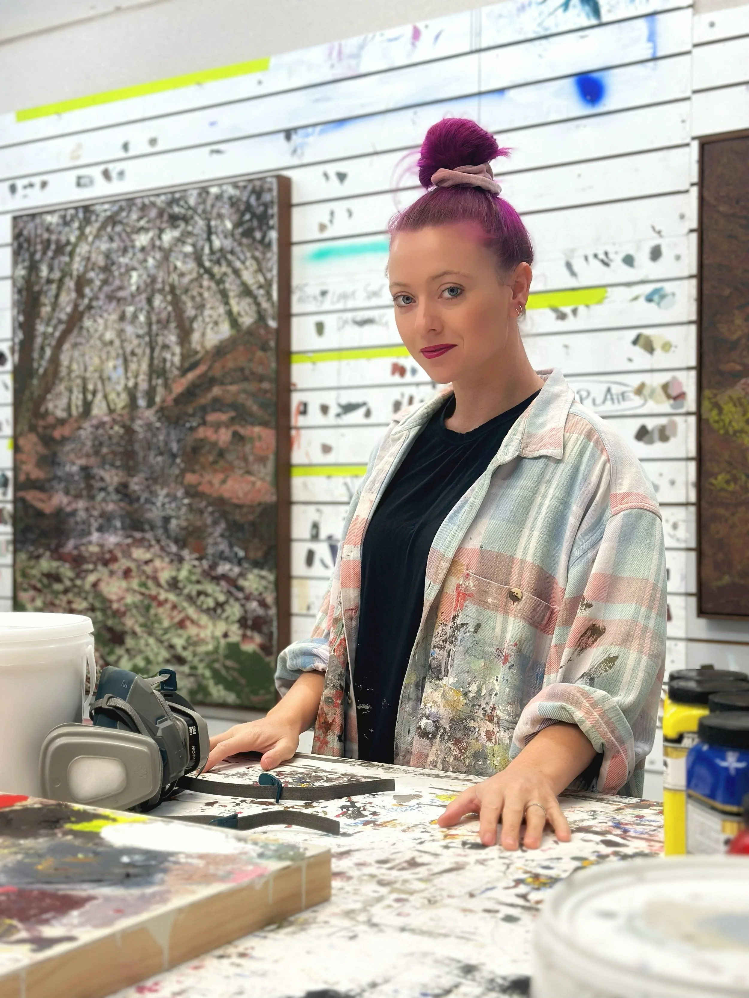 Artist Korynn Morrison standing in studio.