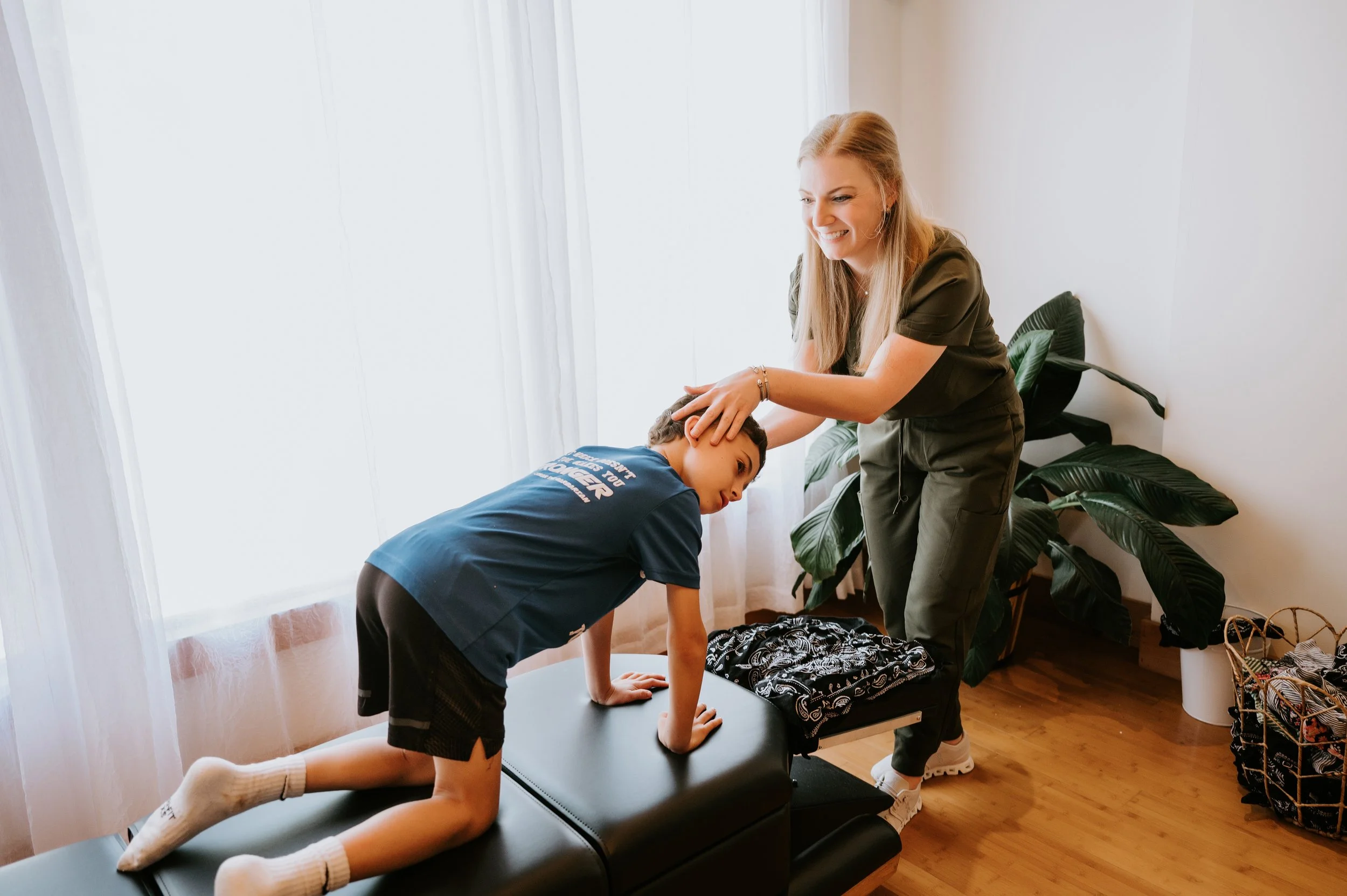 Pediatric chiropractor testing for retained primitive reflexes