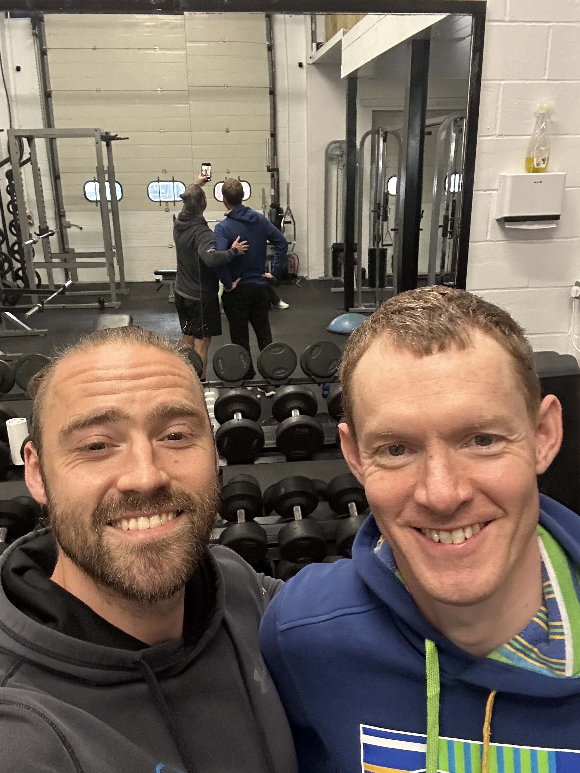 Jamie, owner of jj strength, with one of his personal training clients in his gym in Oxford
