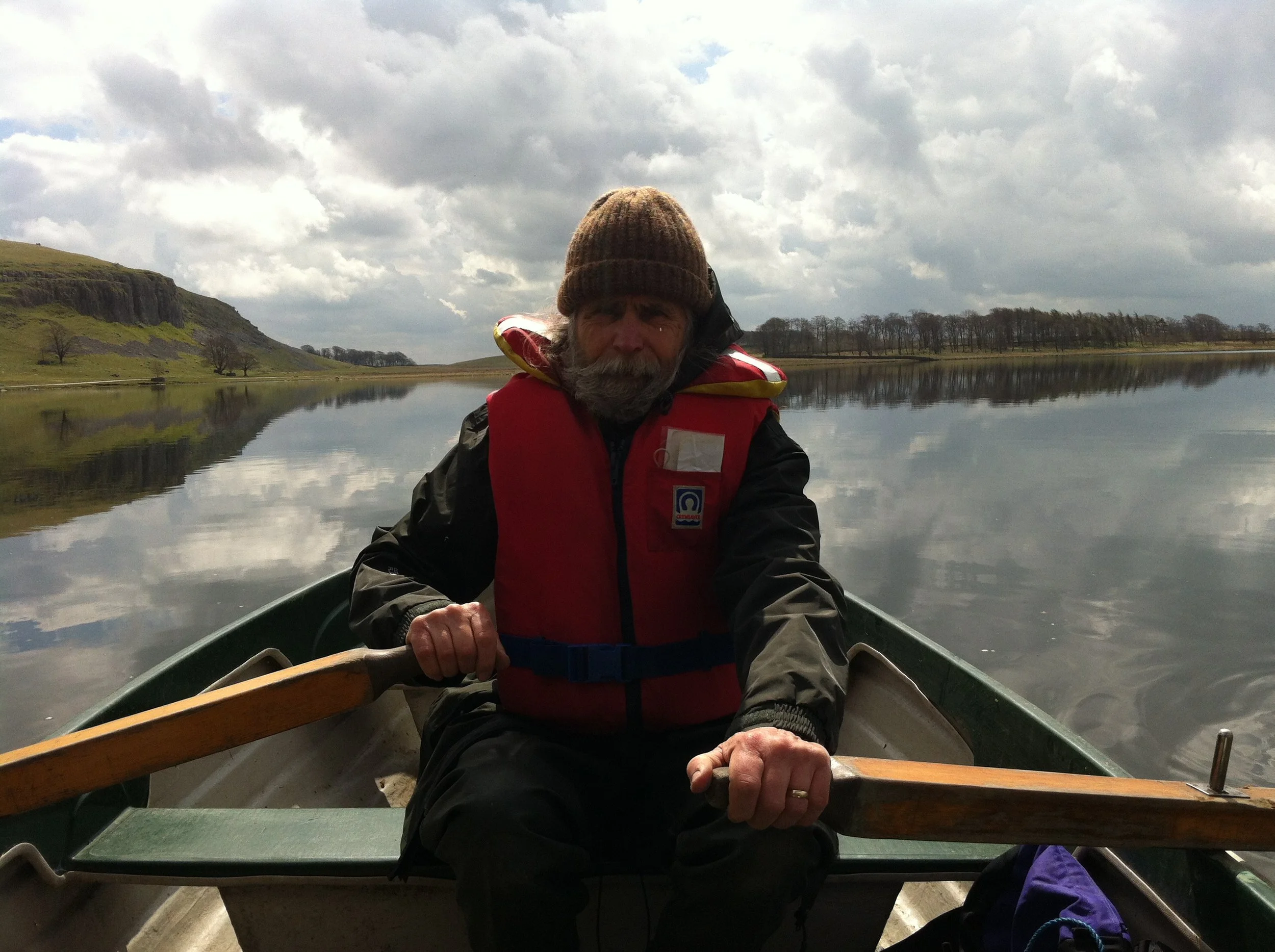 Peter Flint rowing a boat on Malham Tarn during a survey for Agrypnetes.JPG