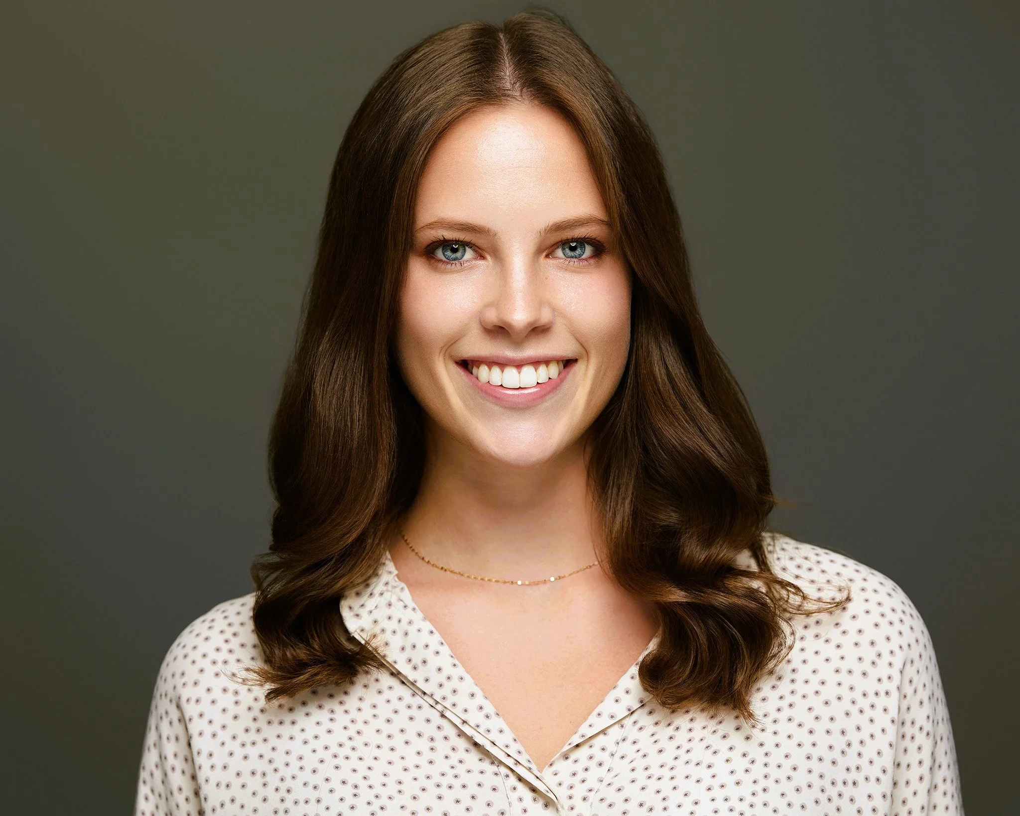 Julie Ocker, licensed clinical social worker specializing in youth and family therapy, smiling warmly