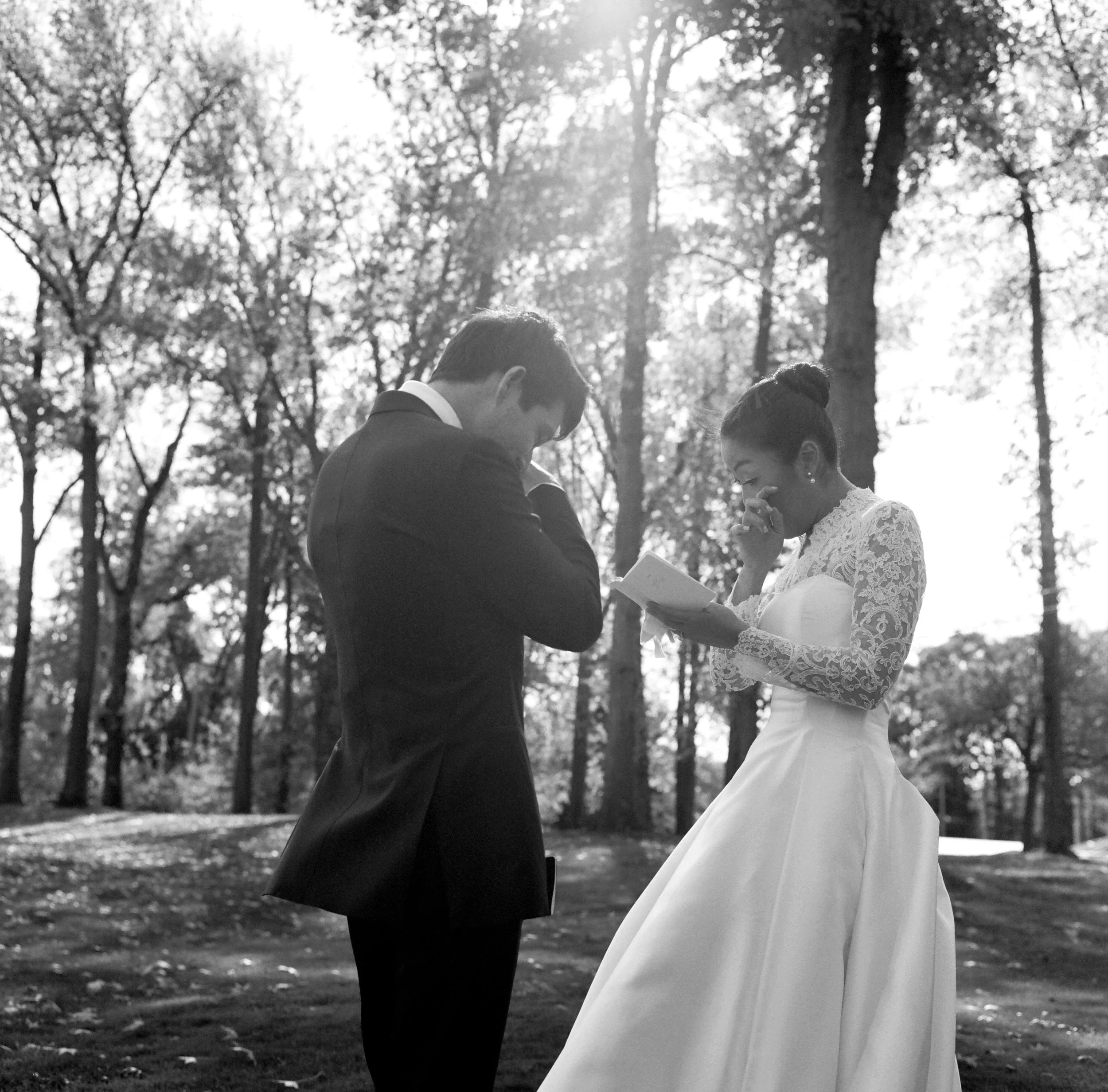 black and white film image of emotional bride and groom vows