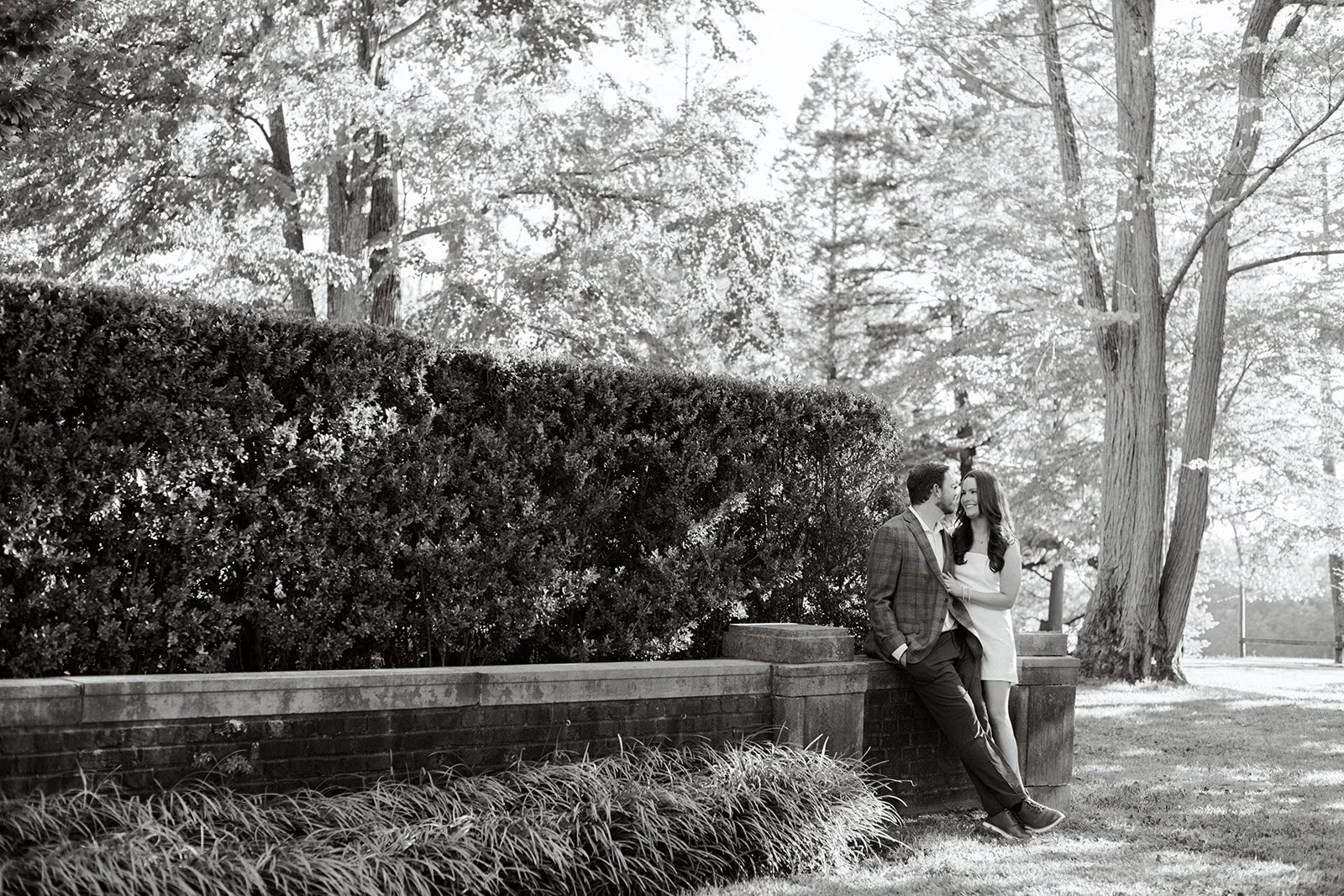 Couple sitting close together on a park bench