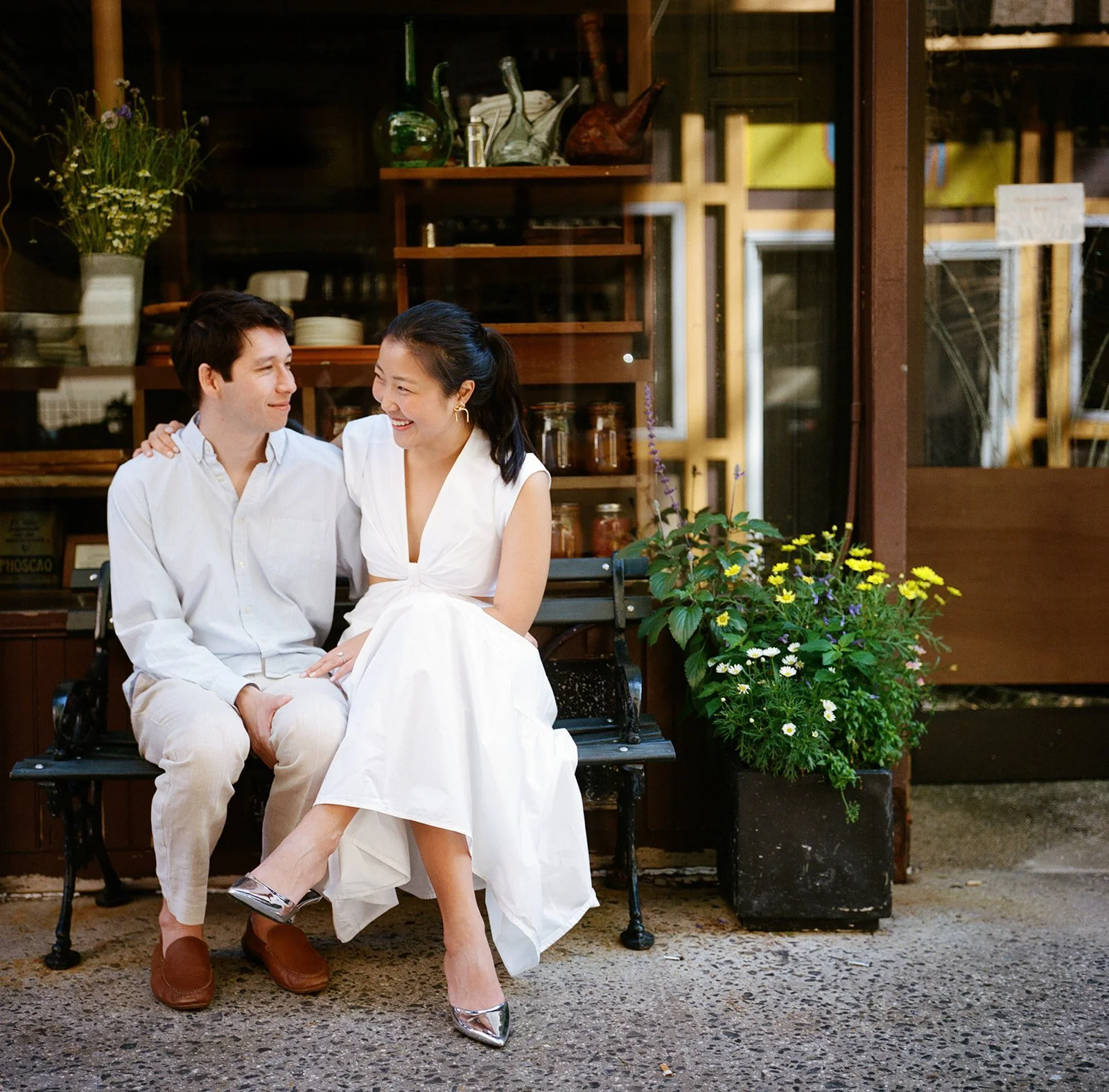 Couple sitting together with woman laughing