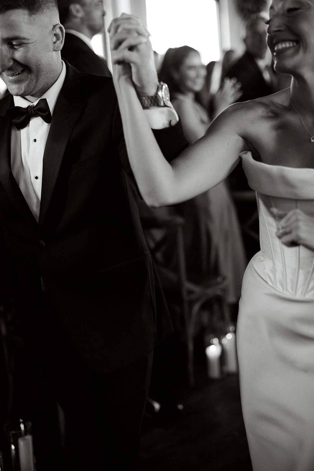 bride and groom linking hands and proceeding down the wedding aisle at Battello restaurant