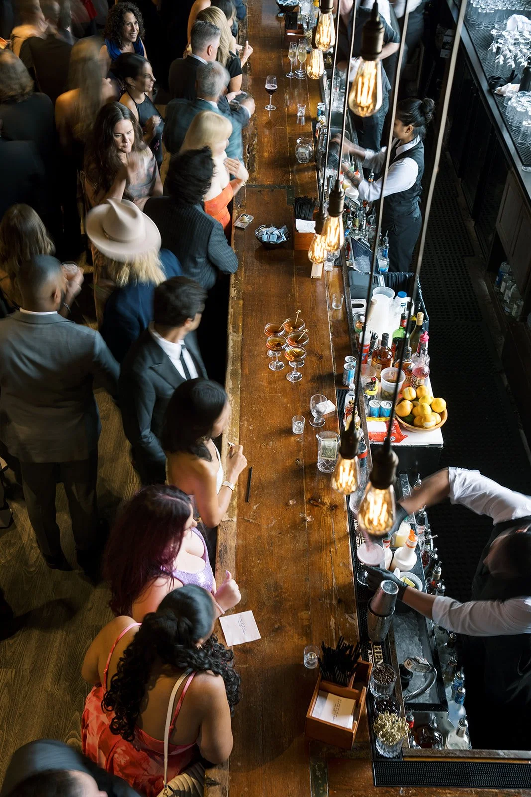 overhead view of busy cocktail bar at Battello
