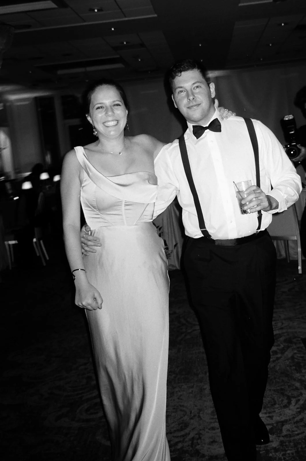 couple dressed in black tie wedding attire 