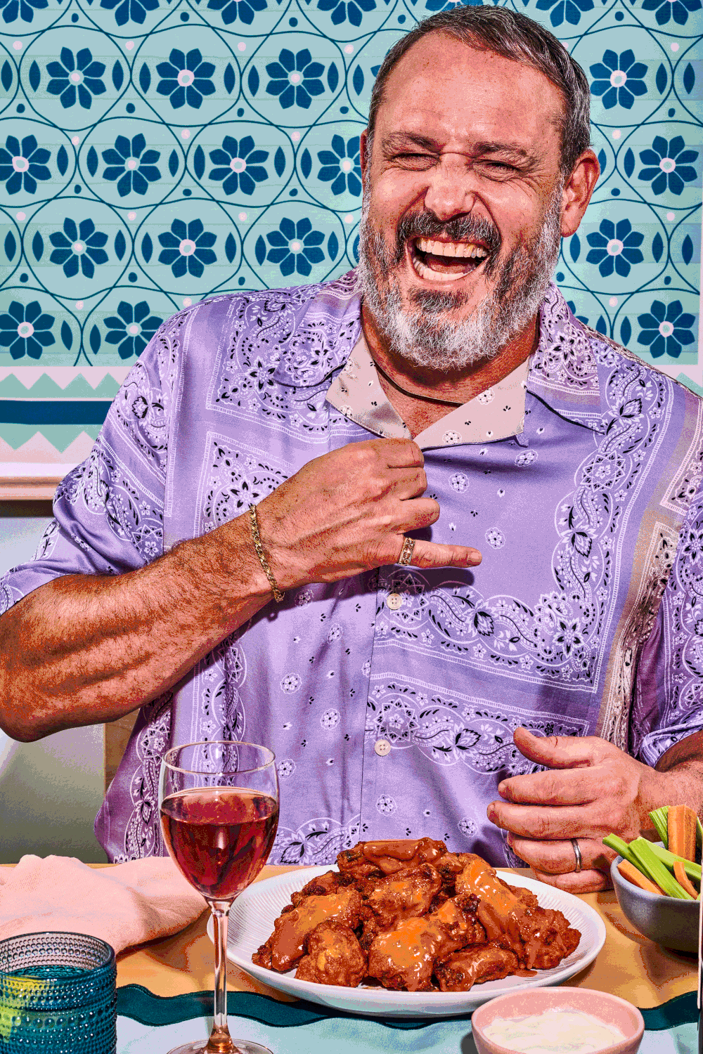 Portrait of Mike eating chicken wings for Dirty Dines Photoshoot