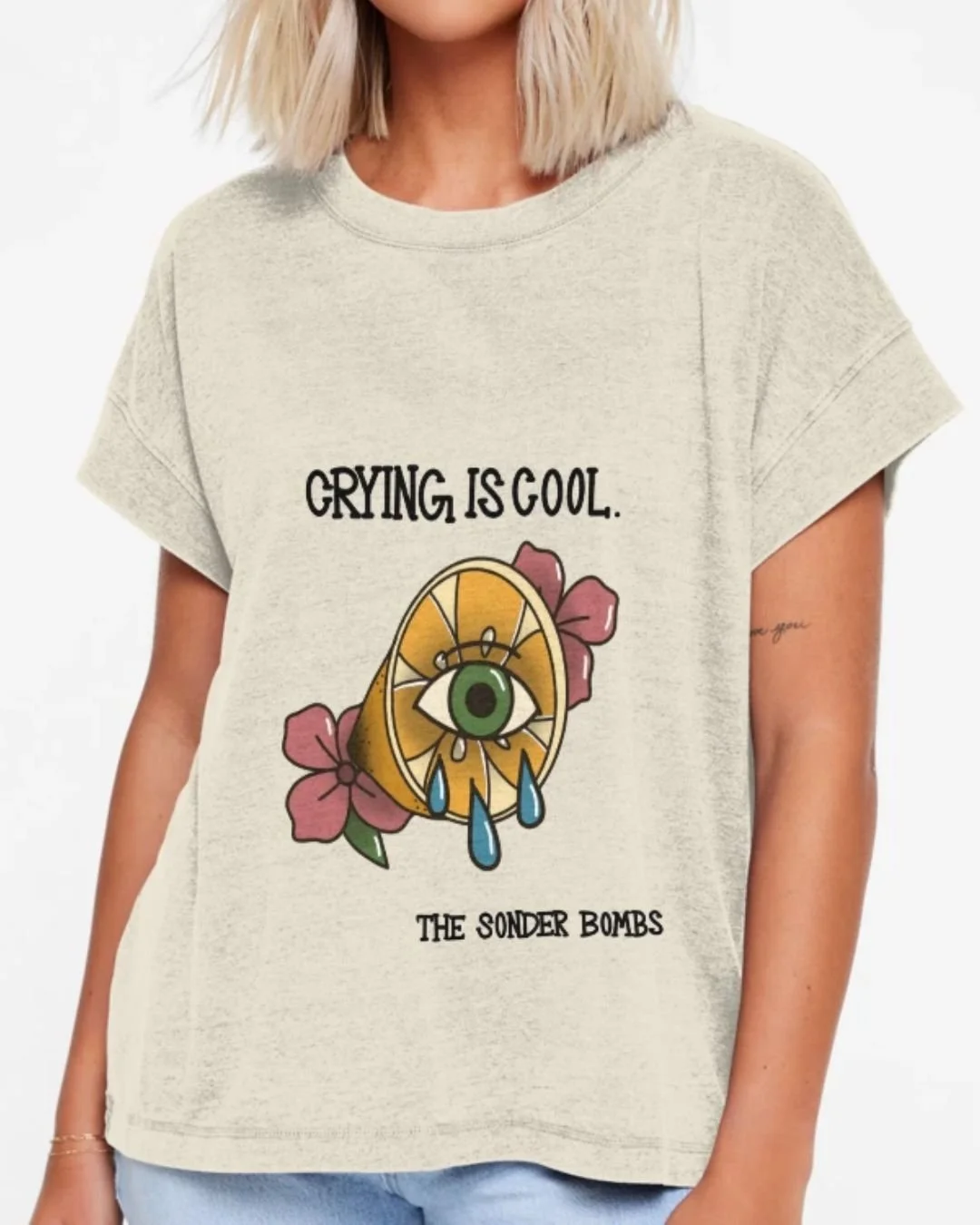 T-shirt picturing a lemon with an eye in the middle crying. text reads "crying is cool" "The Sonder Bombs"
