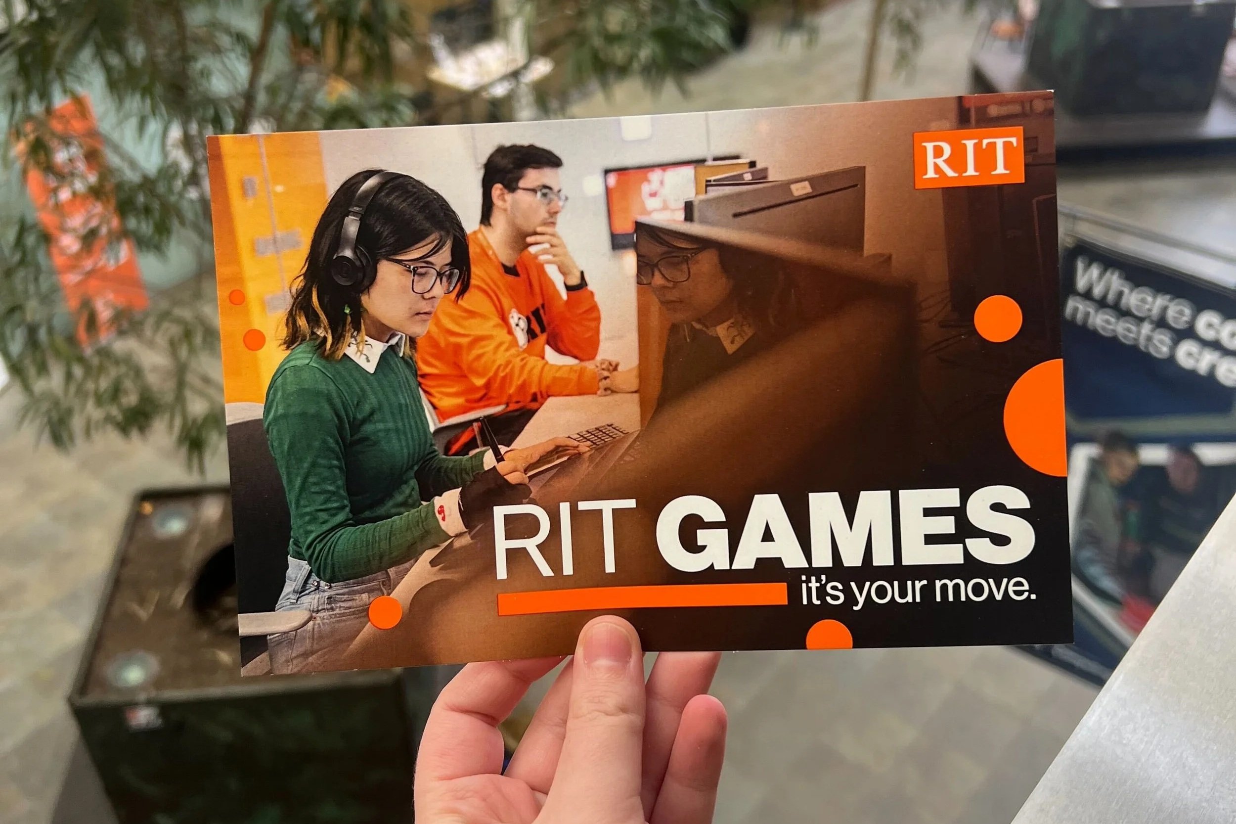 RIT Games postcard - front showing two students working at computers