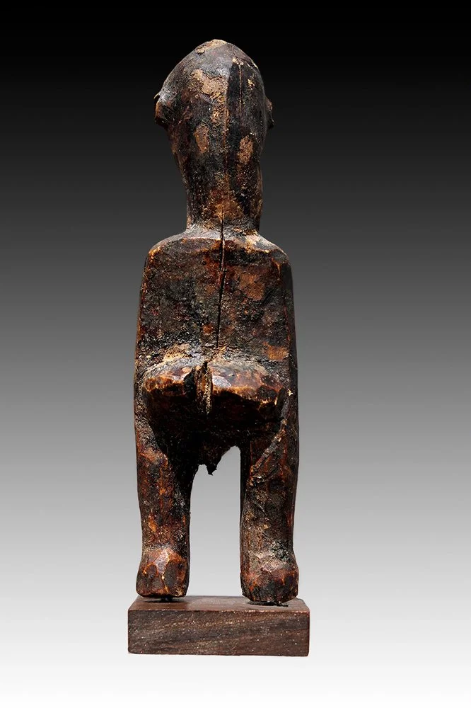 Lobi miniature wood carving with dark brown encrusted patina.  www.gallerytribalart.com
