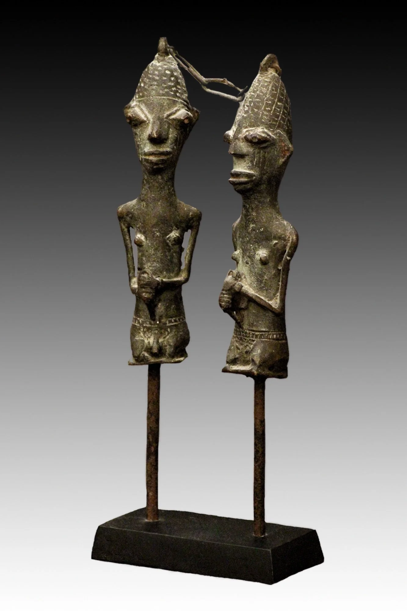 Ogboni edan figures, were worn about the neck of an initiate and carried in public as a sign of office and protective amulet.  www.gallerytribalart.com