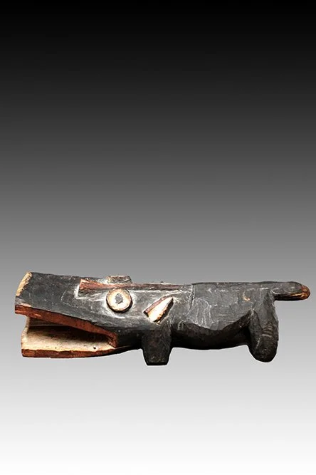 Mambila crocodile wood carving with black, white and red pigments.  www.gallerytribalart.com