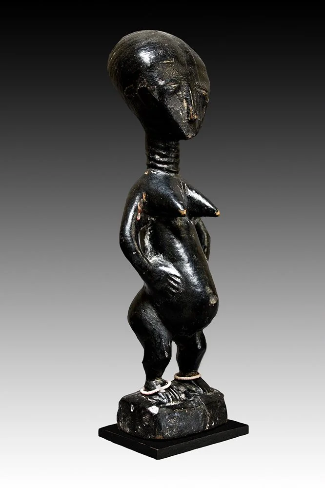 Akan figure with slit eyes and tapering chin.  www.gallerytribalart.com