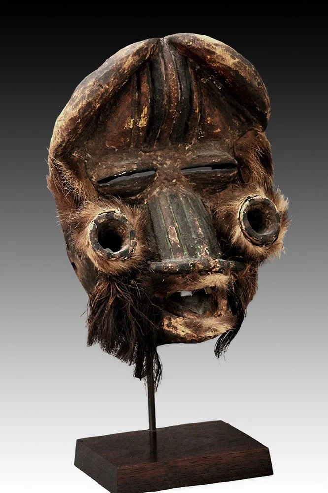 We mask with exaggerated features.  www.gallerytribalart.com