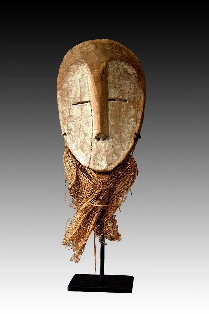 Lega mask with heart shaped face and slit eyes.  www.gallerytribalart.com