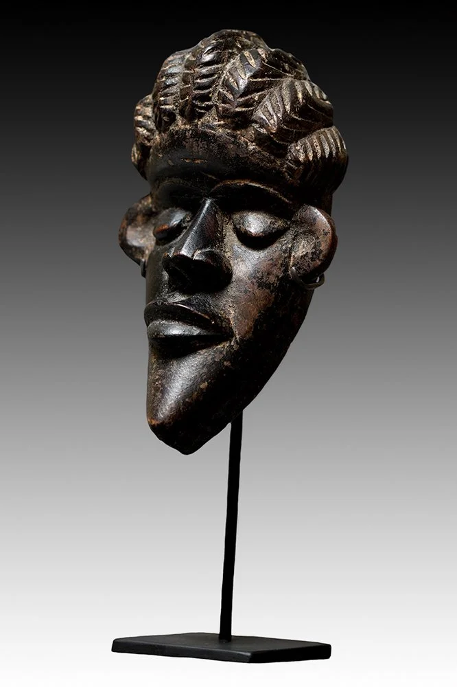 Bassa mask are attached to a woven headdress.  www.gallerytribalart.com