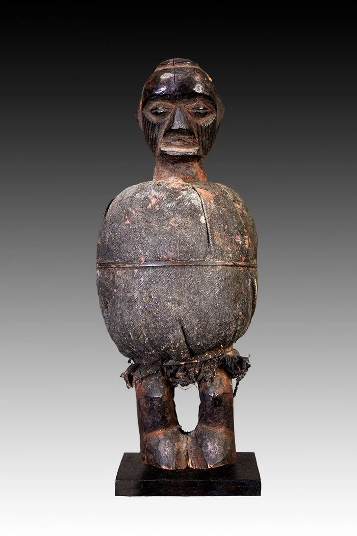 Teke figure wears a chief's headgear.  www.gallerytribalart.com