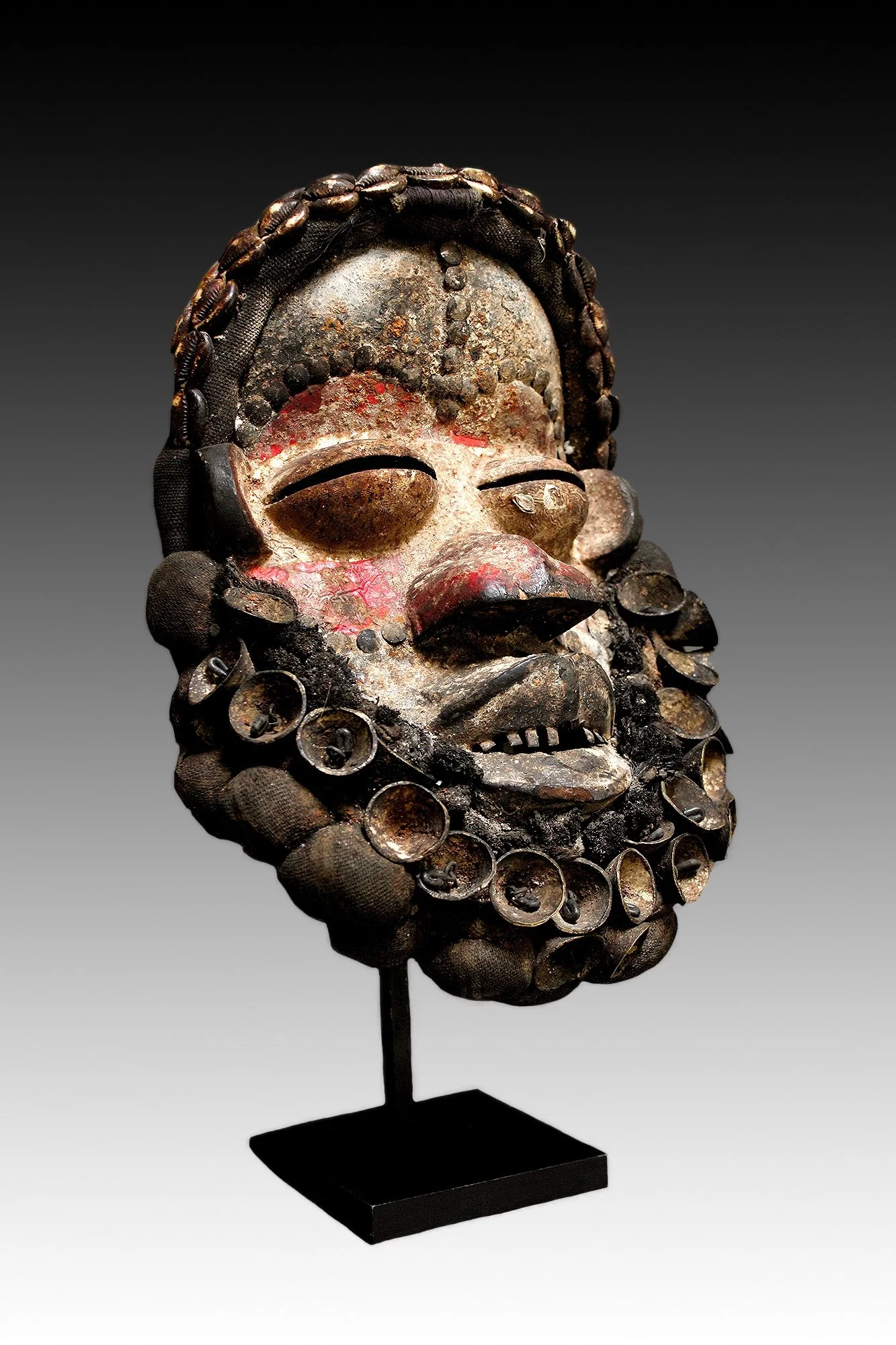 We mask with metal bells, Ivory Coast.  www.gallerytribalart.com