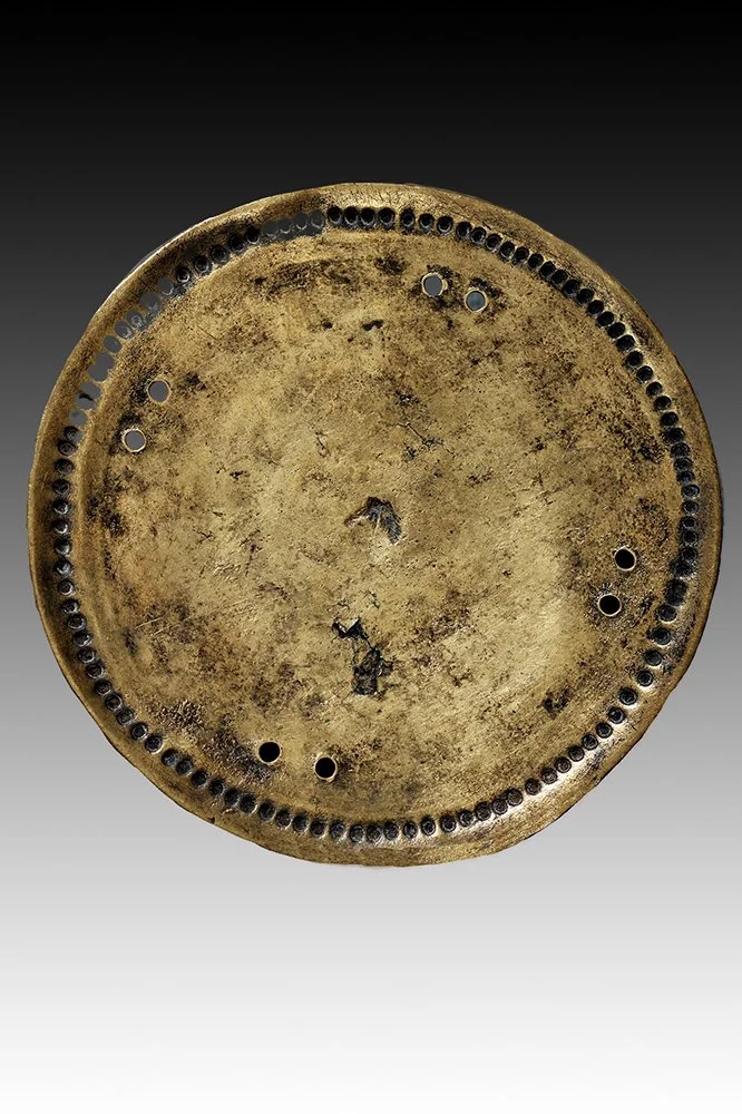 Borana brass ornament with perferated holes to attach to clothing.  www.gallerytribalart.com
