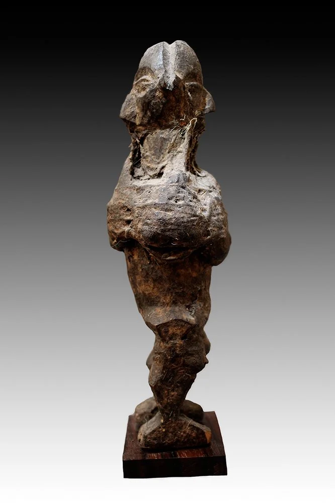 Yaka figures joined together with encrusted patina.  www.gallerytribalart.com