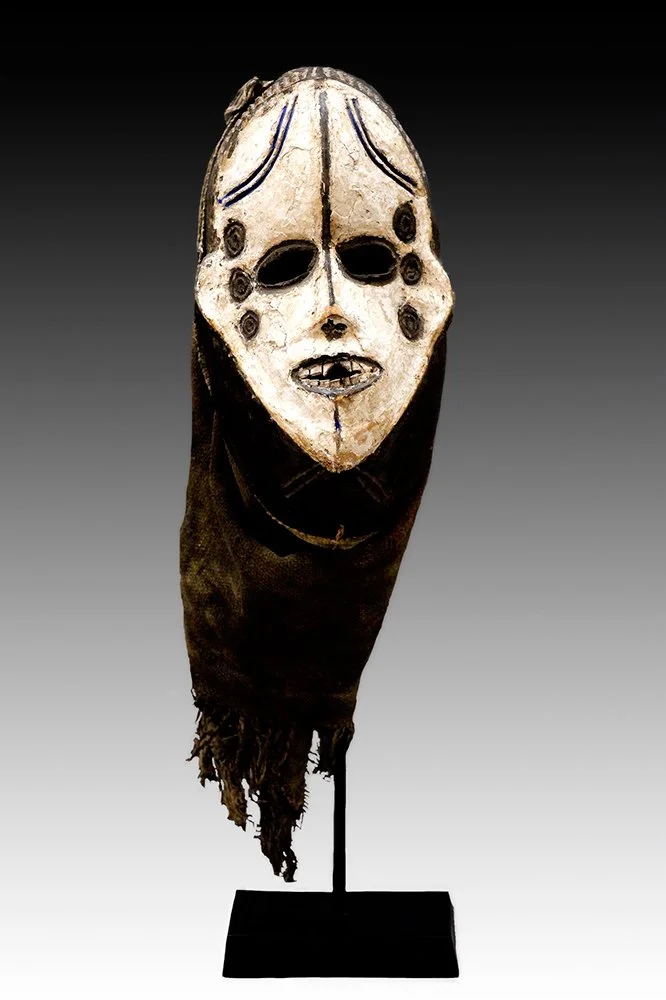 Igbo Okoroshi mask with white pigment and black keloid markings.  www.gallerytribalart.com