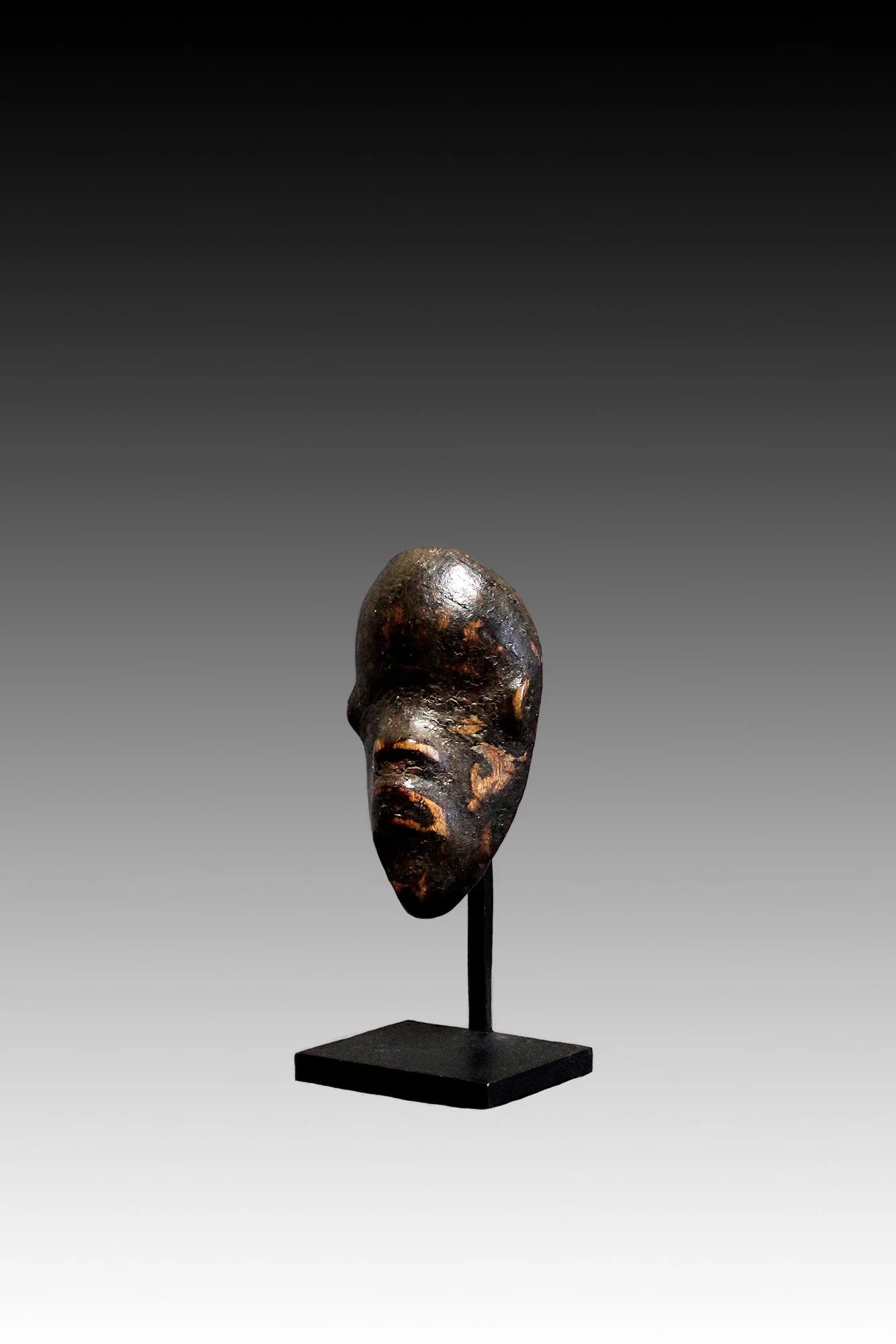 Dan passport mask, miniature African wood carvings.  www.gallerytribalart.com