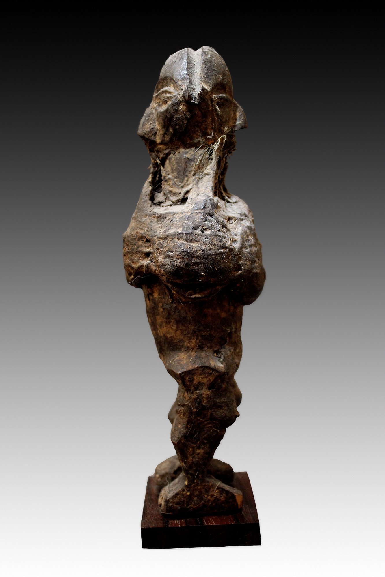 Yaka carved wooden encrusted statue