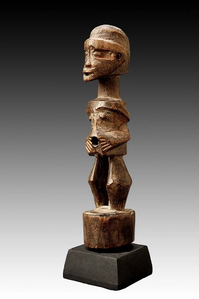 Songye figure was used for healing, fertility and protection from evil spirits, sorcerers and hostile powers.  www.gallerytribalart.com