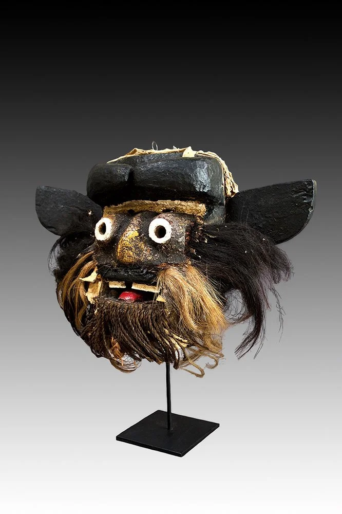Guere mask with horns on forhead, similar to Dan and Wobe.  www.gallerytribalart.com