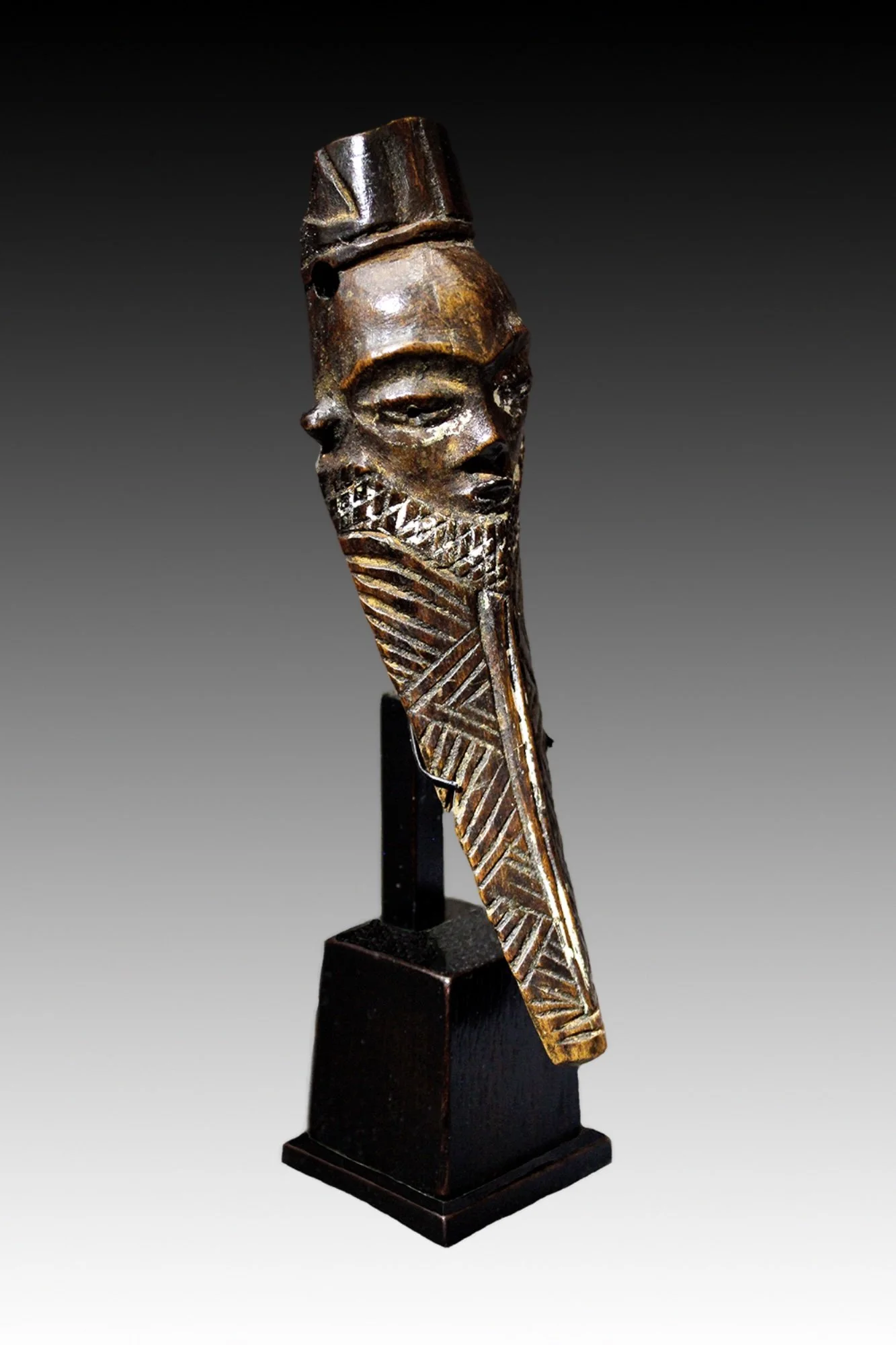 Pende Ikhoko  amulets were given to young initiates to serve as a protective talisman and to reinforce societal morals and values.  www.gallerytribalart.com