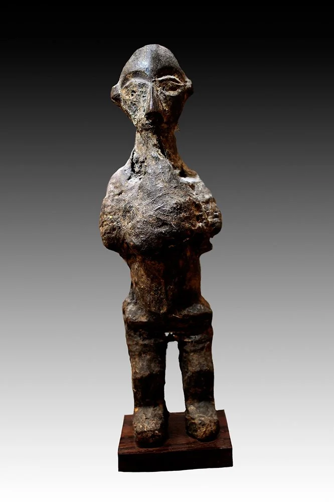 Yaka fetish figures with heavy lidded eyes and linear nose.  www.gallerytribalart.com
