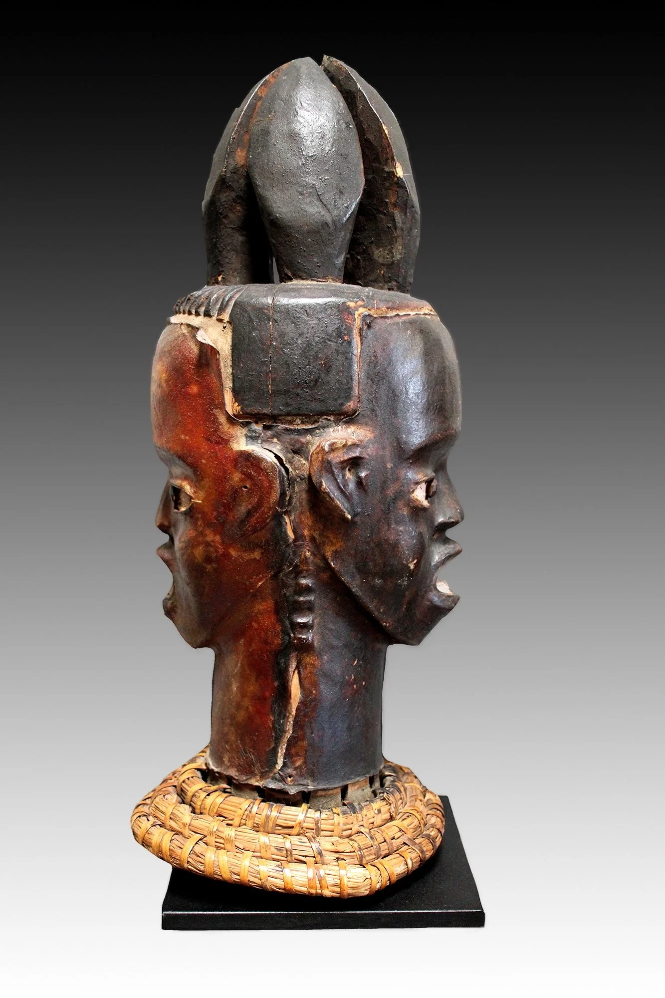 Ekoi janus faced headdress on basket, www.gallerytribalart.com