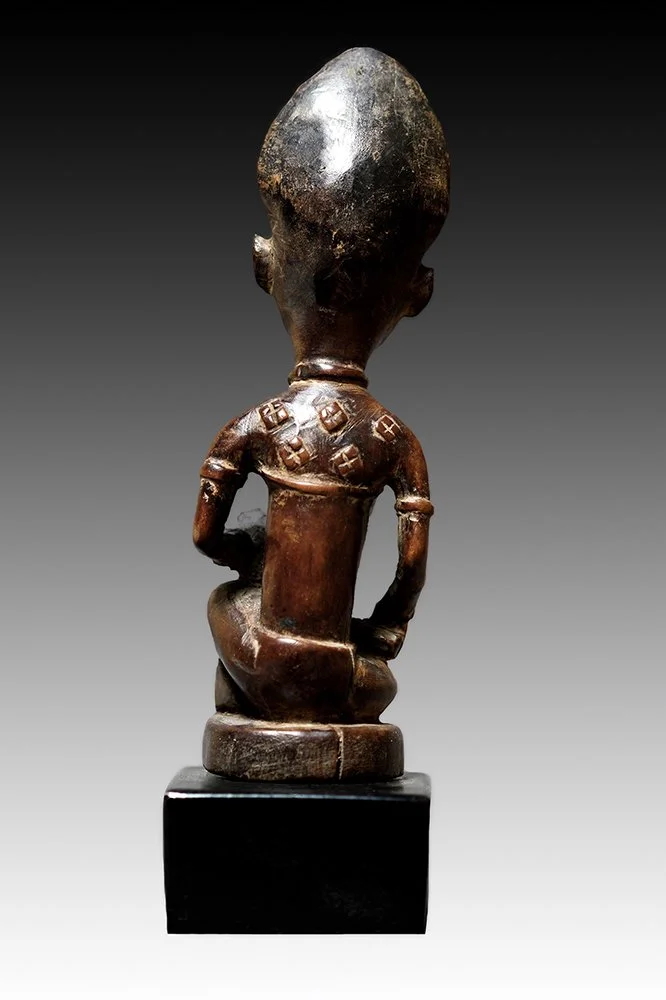 Yombe mother with symbolic scarification to chest and back.  www.gallerytribalart.com