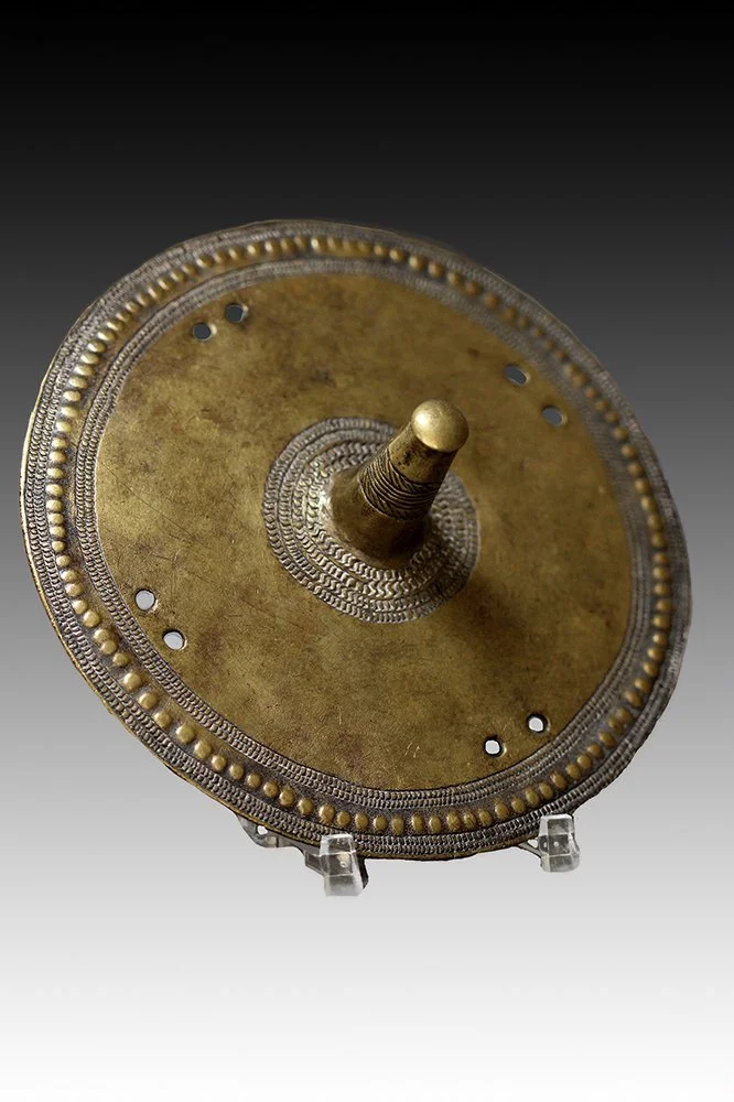 Borana ornament has a large projection in the middle.  www.gallerytribalart.com