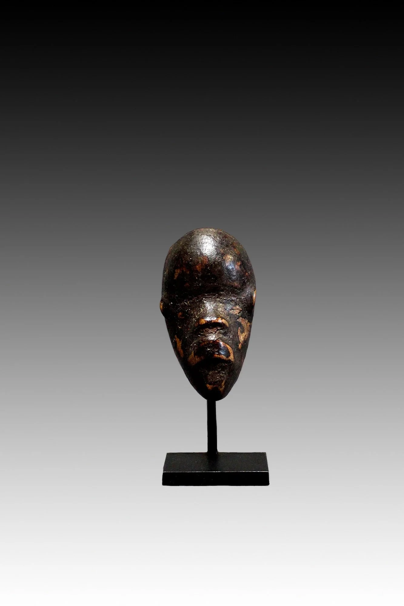 Dan mask, Ivory Coast, small masks can fit into a hand and are carried in a pouch.  www.gallerytribalart.com