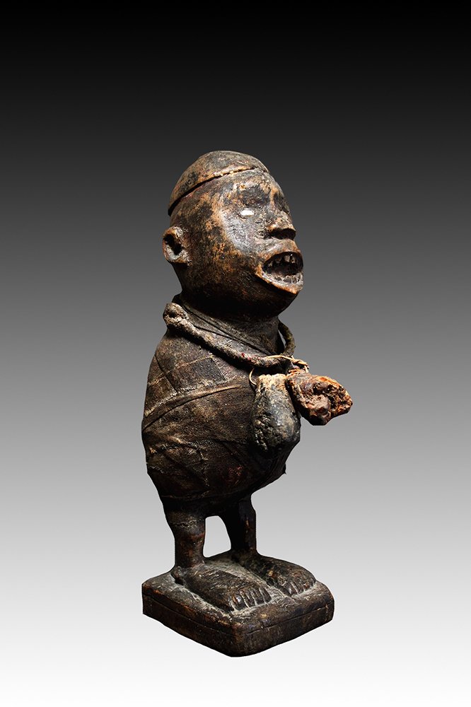 Kongo figure with mirrored cavity holding secret medicines.  www.gallerytribalart.com