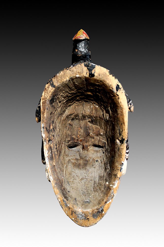Ibo wood carved mask with old adze markings.  www.gallerytribalart.com