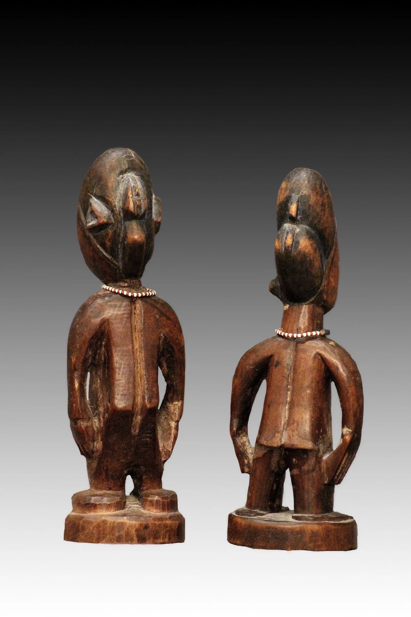 Yoruba Ibeji twins, back view, skillfully carved.  www.gallerytribalart.com