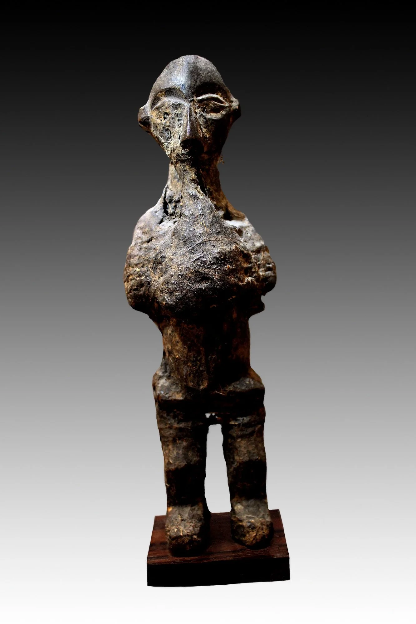 Yaka fetish figure is covered with highly encrusted hide and bundles of fetish materials.  www.gallerytribalart.com