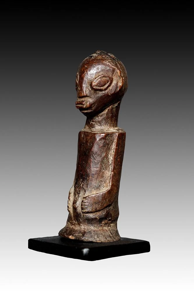 Luba fetish figure has magical materials embedded into a cavity on top of the head.  www.gallerytribalart.com
