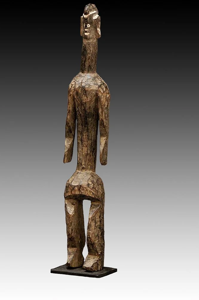 Mumuye with bent knees and cylindrical torso.  www.gallerytribalart.com
