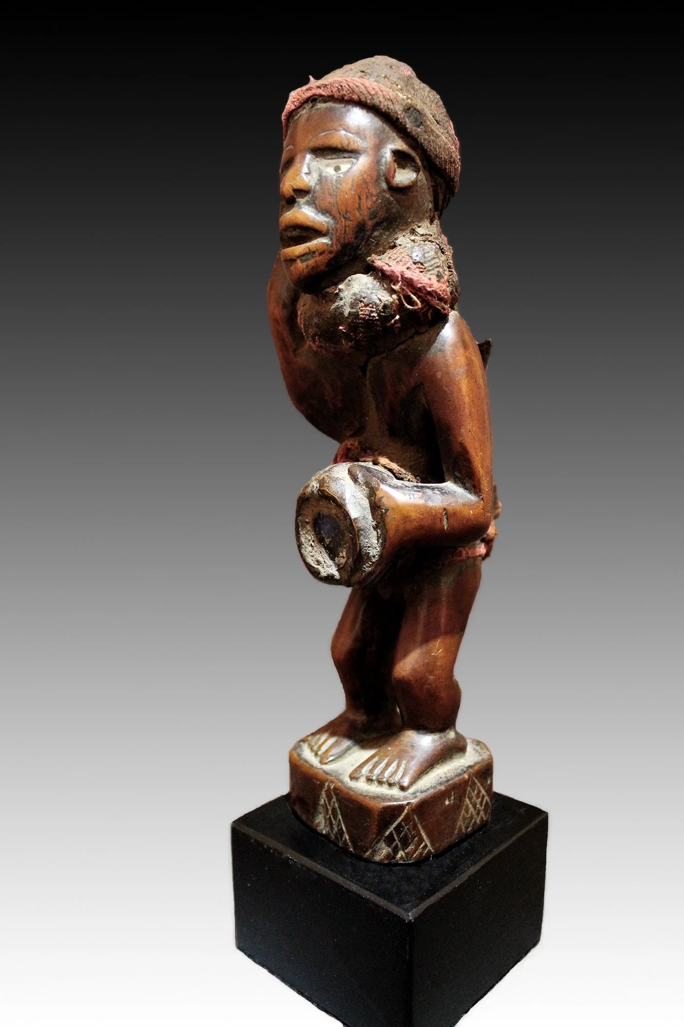 Exceptional Kongo figure with glass abdomen and fine patina, Paris collection.  www.gallerytribalart.com