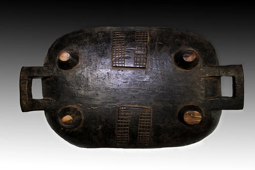 Zulu meat platter with geometric designs, resting on feet.  www.gallerytribalart.com