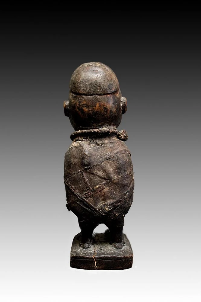 Kongo figure with magical materials wrapped in leather.  www.gallerytribalart.com